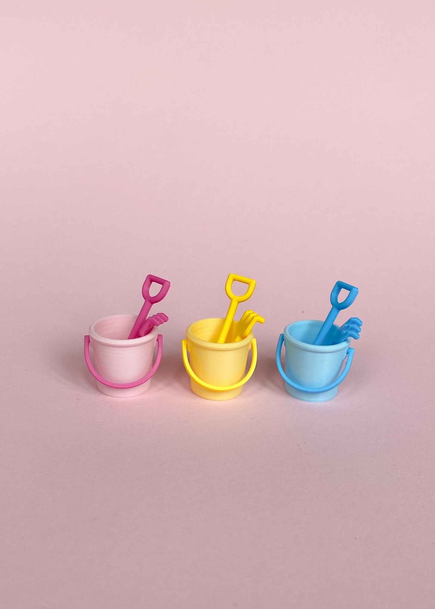 Miniature bucket, little shovel and rake.