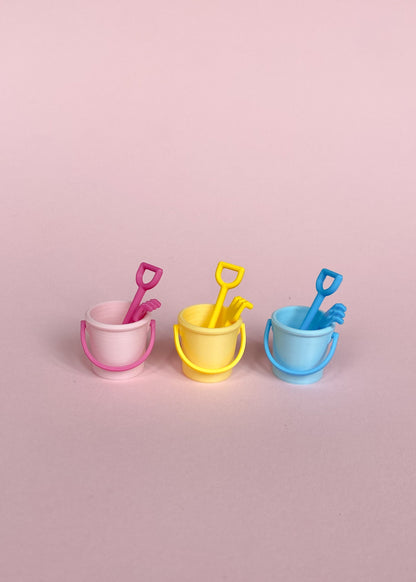 Miniature bucket, little shovel and rake.
