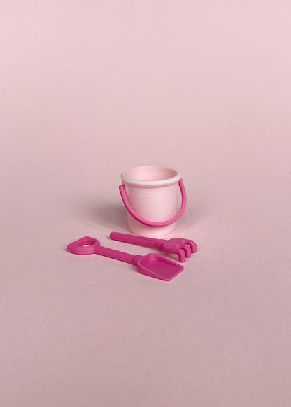 Miniature bucket, little shovel and rake.