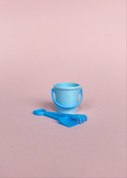 Miniature bucket, little shovel and rake.