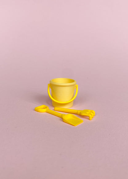 Miniature bucket, little shovel and rake.