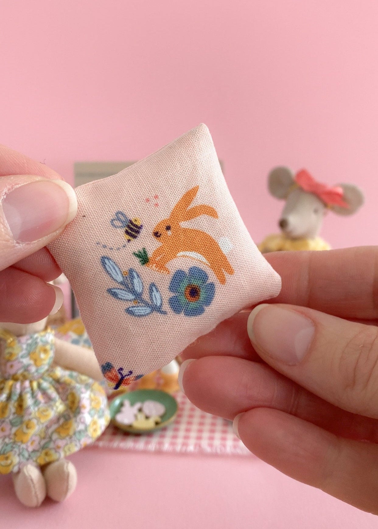 Miniature square pillow with bunny design