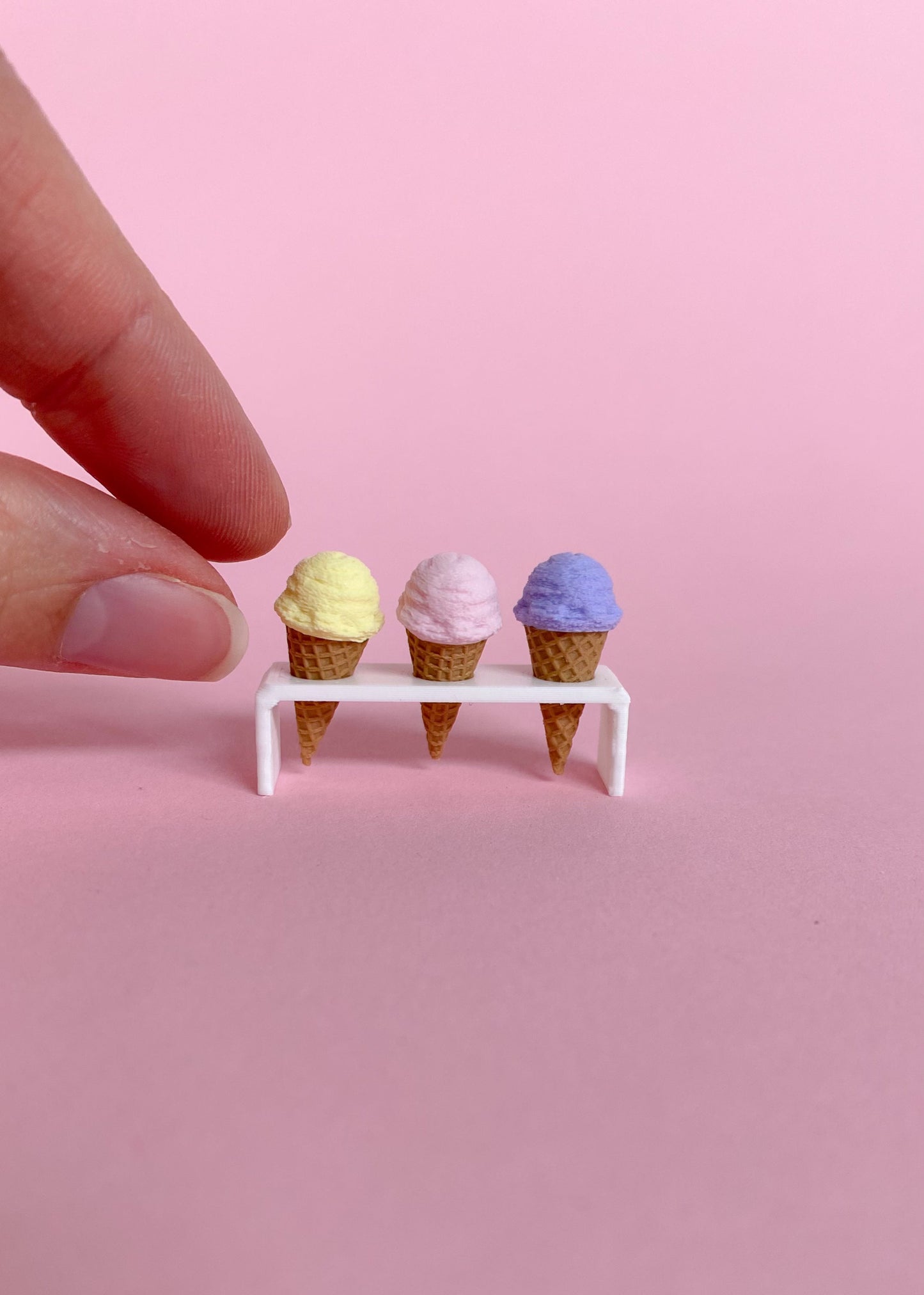 Three magnetic miniature ice cream cones with holder