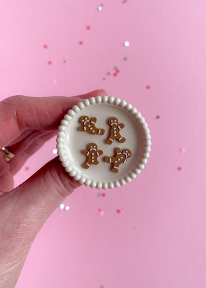 Gingerbread man cookies, partially eaten, miniature